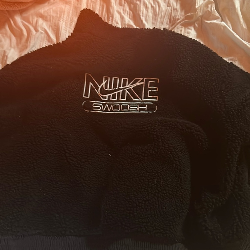 black fluffy on the outside but wind breaker on the inside.